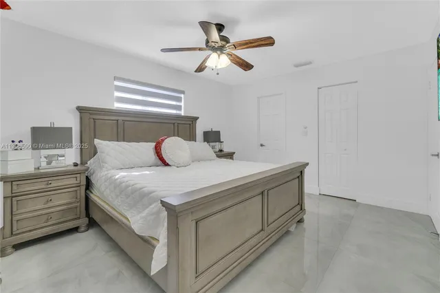 a bedroom with a bed and window