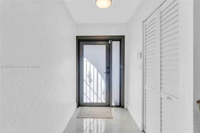 a view of a hallway with windows