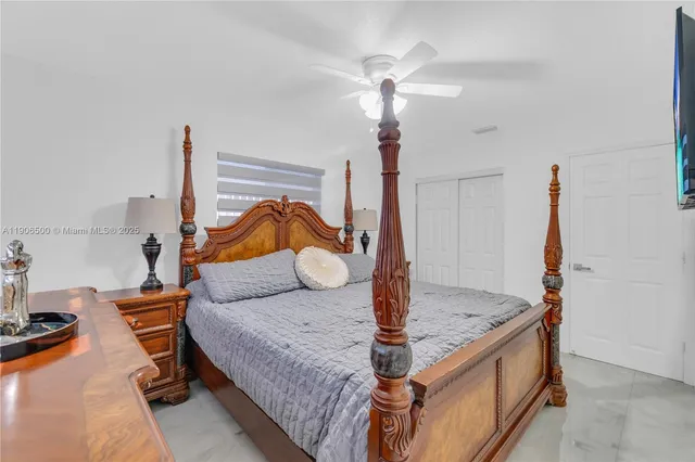 a living room with kitchen island granite countertop furniture and a chandelier
