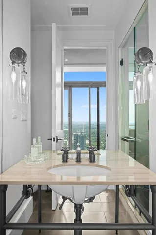 a view of a dining room with furniture and a chandelier