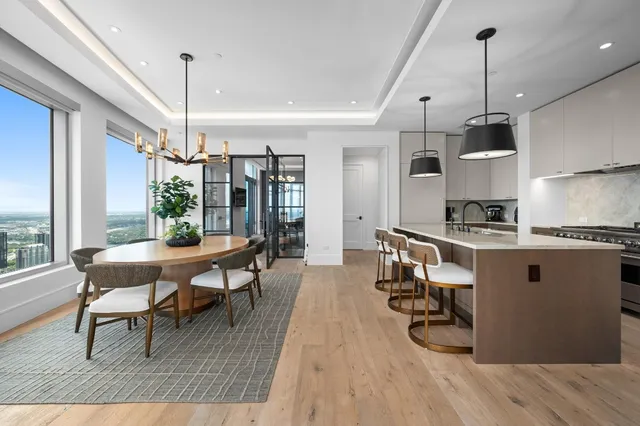 a dining room with furniture and wooden floor