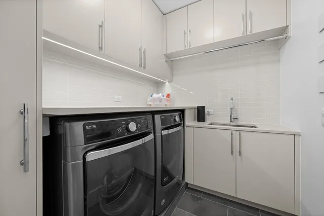 a utility room with dryer and washer