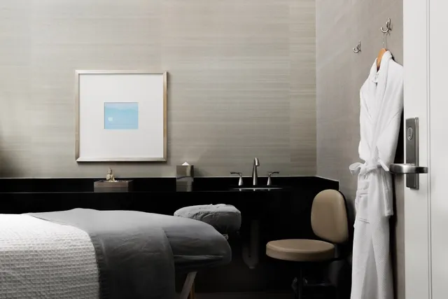 a view of a dining room with furniture and window