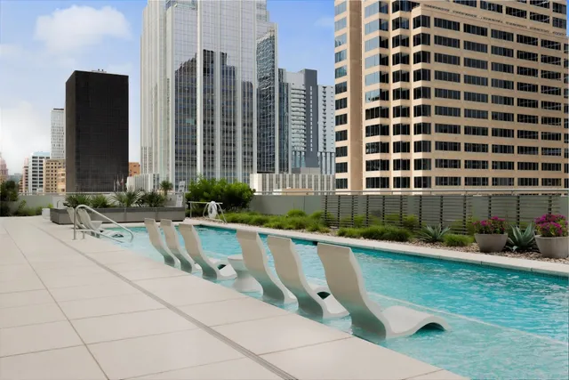 a view of swimming pool with chairs