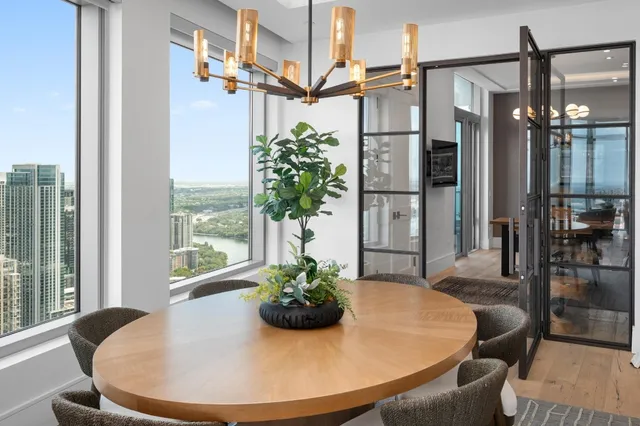 a view of a dining room with furniture window and wooden floor