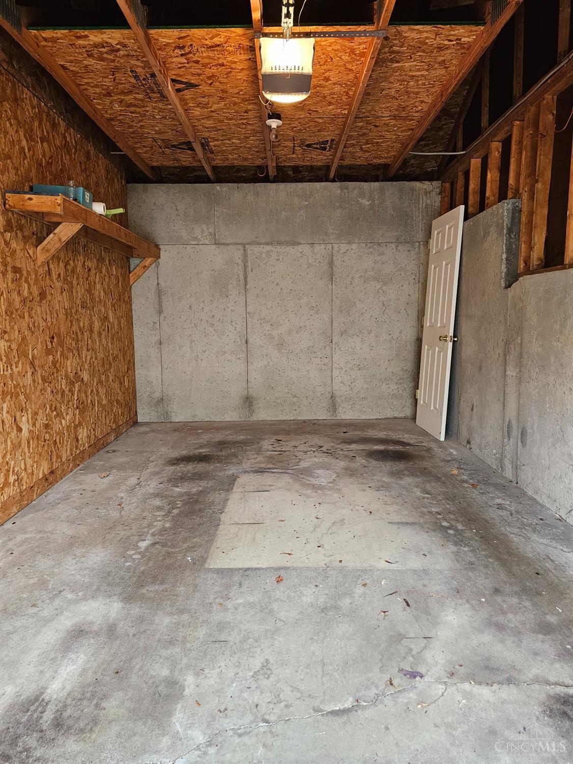 4331 Regency Ridge Court, Unit 306 Cincinnati, OH 45248 - Photo 39 of 45 Garage has an opener, shelf, and storage above!