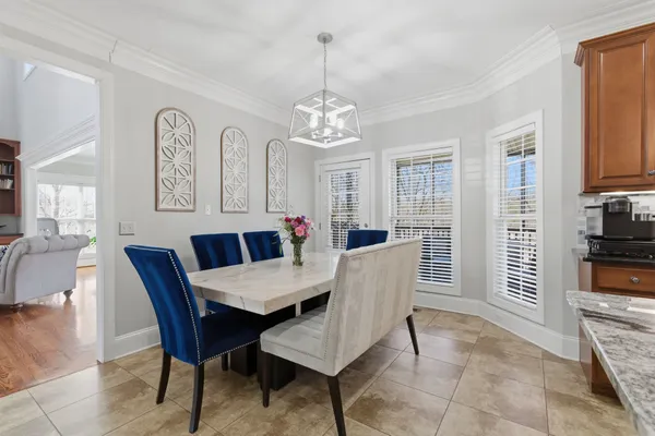 a kitchen with a counter top space a sink stainless steel appliances and cabinets