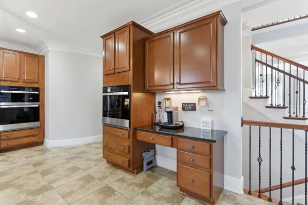 a bathroom with a granite countertop sink a large mirror and a shower