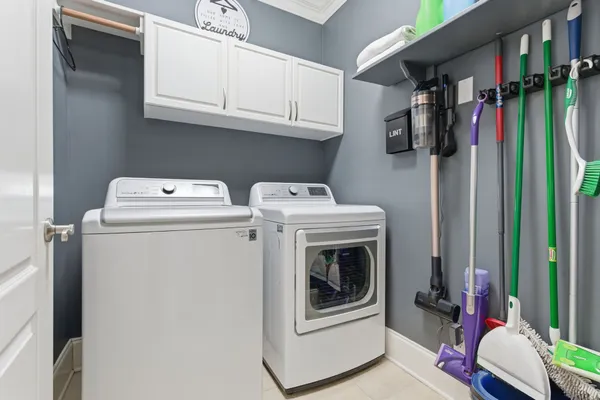 a spacious bedroom with a bed and a flat screen tv