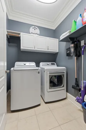 a spacious bedroom with a bed and a flat screen tv