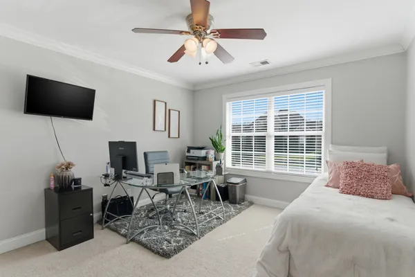 a bedroom with a large bed and a closet