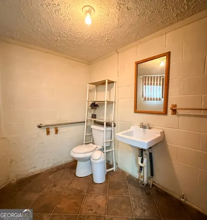 a bedroom with a bed and a furniture