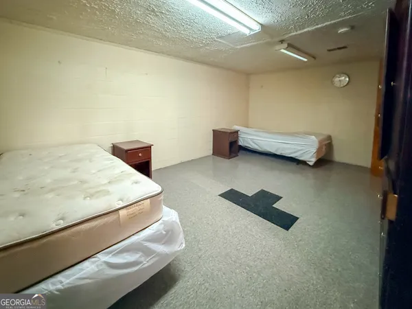 a bedroom with furniture and a window