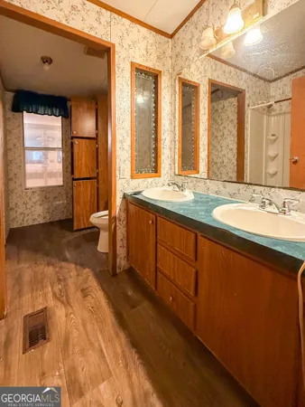 a view of a patio with table and chairs with wooden floor