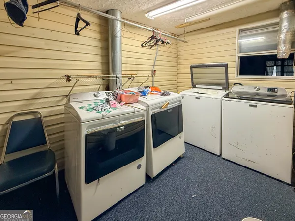 a kitchen with stainless steel appliances stove microwave and cabinets