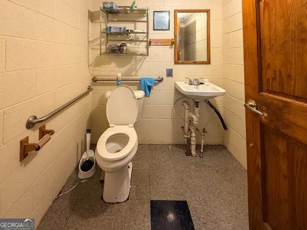 a bathroom with a toilet and a sink