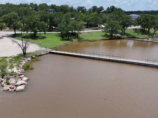 141 Diamond Oaks Drive Nocona, TX 76255 - Photo 15 of 16 an aerial view of a house with a yard and lake view