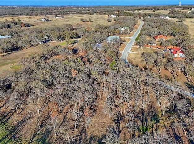 141 Diamond Oaks Drive Nocona, TX 76255 - Photo 16 of 16 an aerial view of house with yard