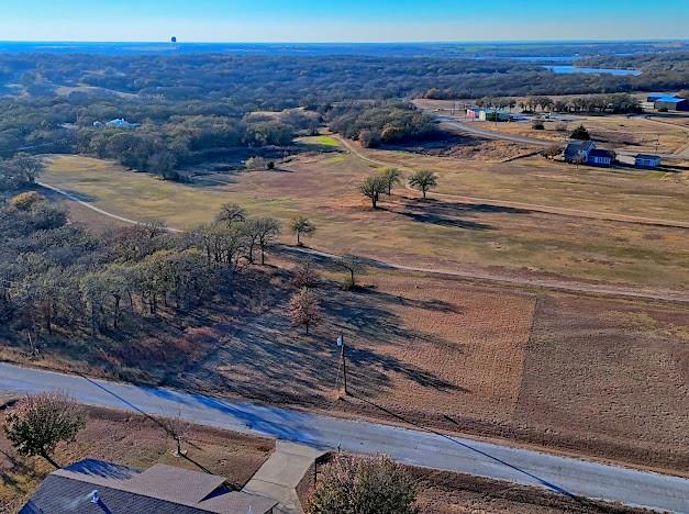 141 Diamond Oaks Drive Nocona, TX 76255 - Photo 6 of 16 a view of car parked on the road