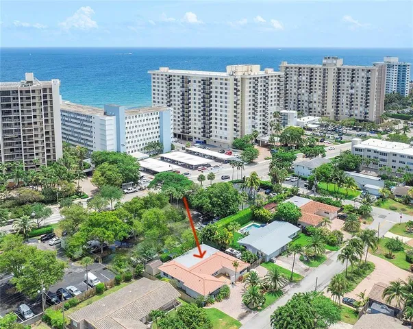 a living room with furniture or couch and a large window