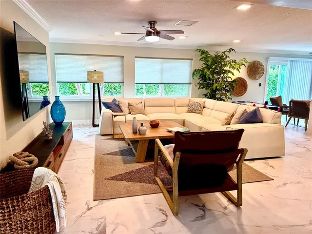 a bathroom with a toilet sink vanity and shower