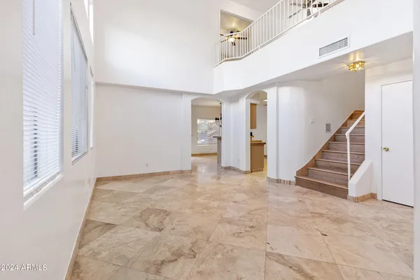 a view of an empty room with stairs