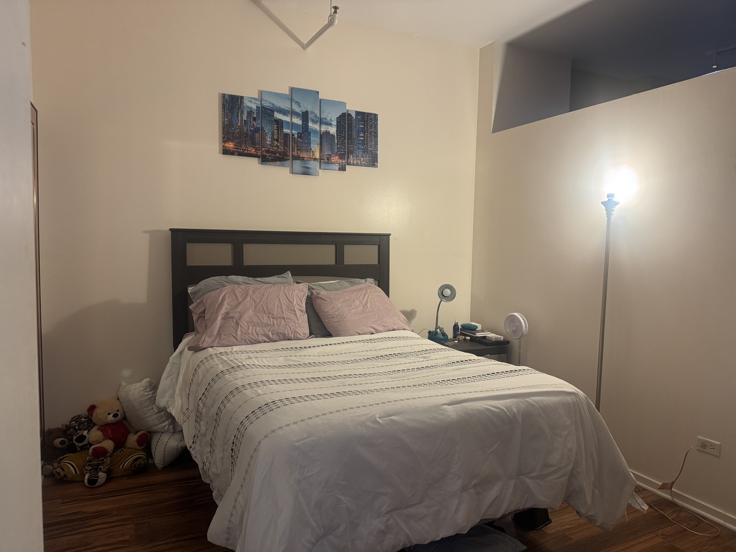 2323 West Pershing Road, Unit 417 Chicago, IL 60609 - Photo 4 of 8 a bedroom with a bed and wooden floor