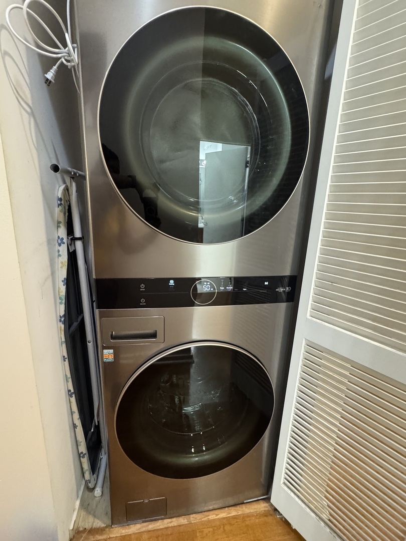 2323 West Pershing Road, Unit 417 Chicago, IL 60609 - Photo 7 of 8 a utility room with a washer and dryer