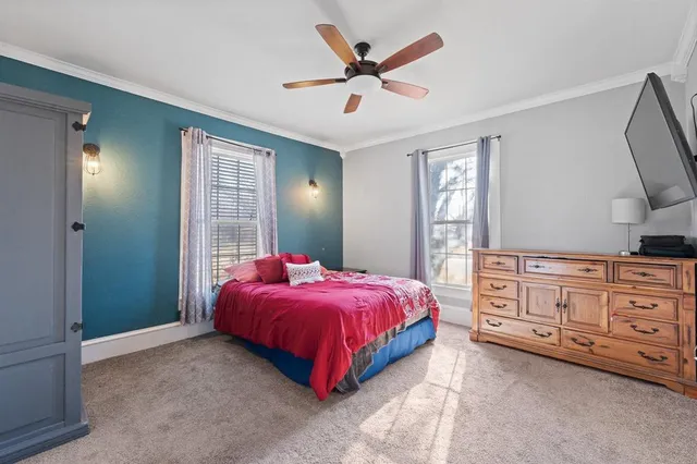 a bed room with a bed and a dresser