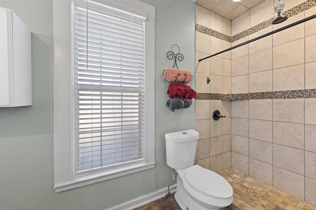 700 Euclid Street Cleburne, TX 76033 - Photo 18 of 35 a white toilet sitting next to a bathroom sink