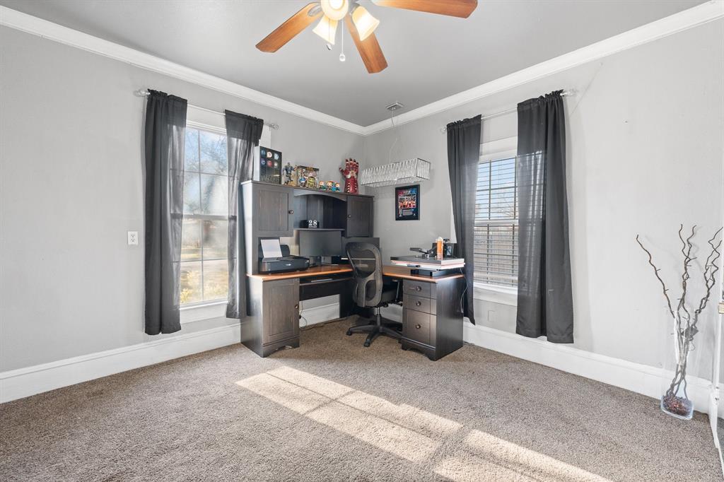 700 Euclid Street Cleburne, TX 76033 - Photo 20 of 35 a kitchen with a refrigerator and a sink
