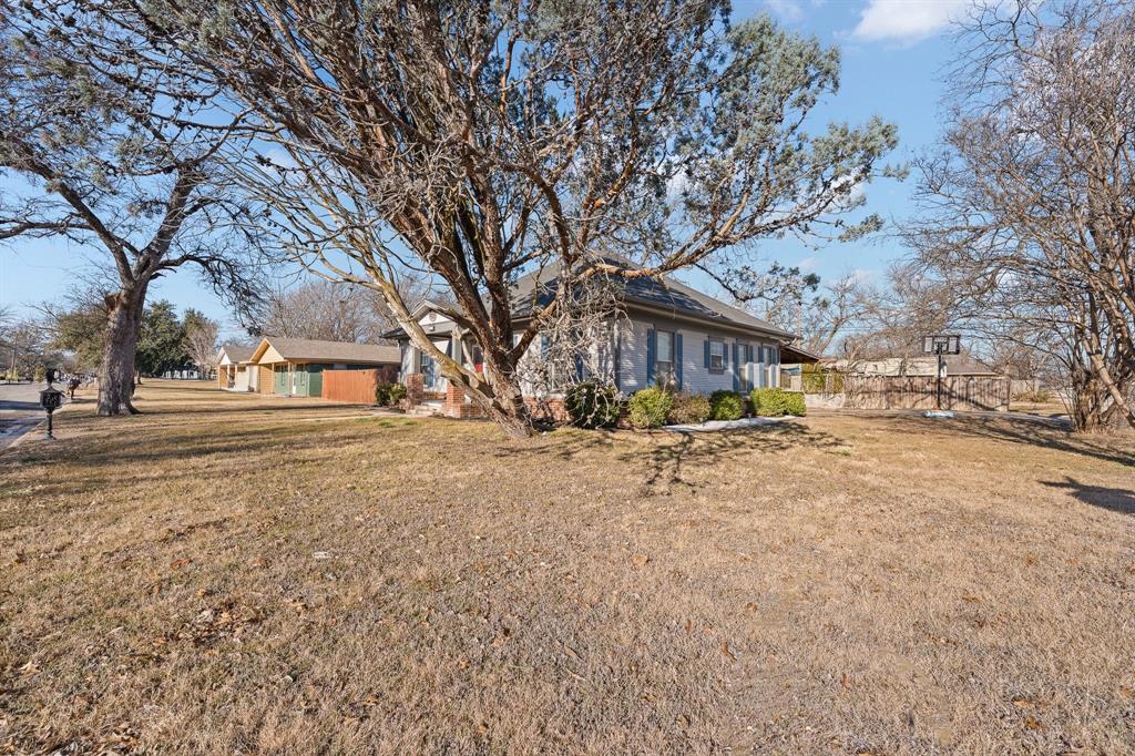 700 Euclid Street Cleburne, TX 76033 - Photo 2 of 35 a view of road with large trees