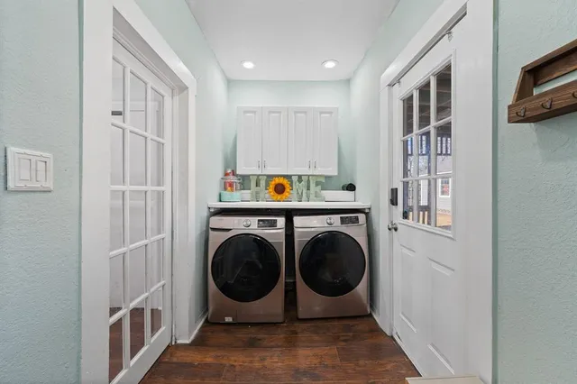 a view of a hallway with washer and dryer