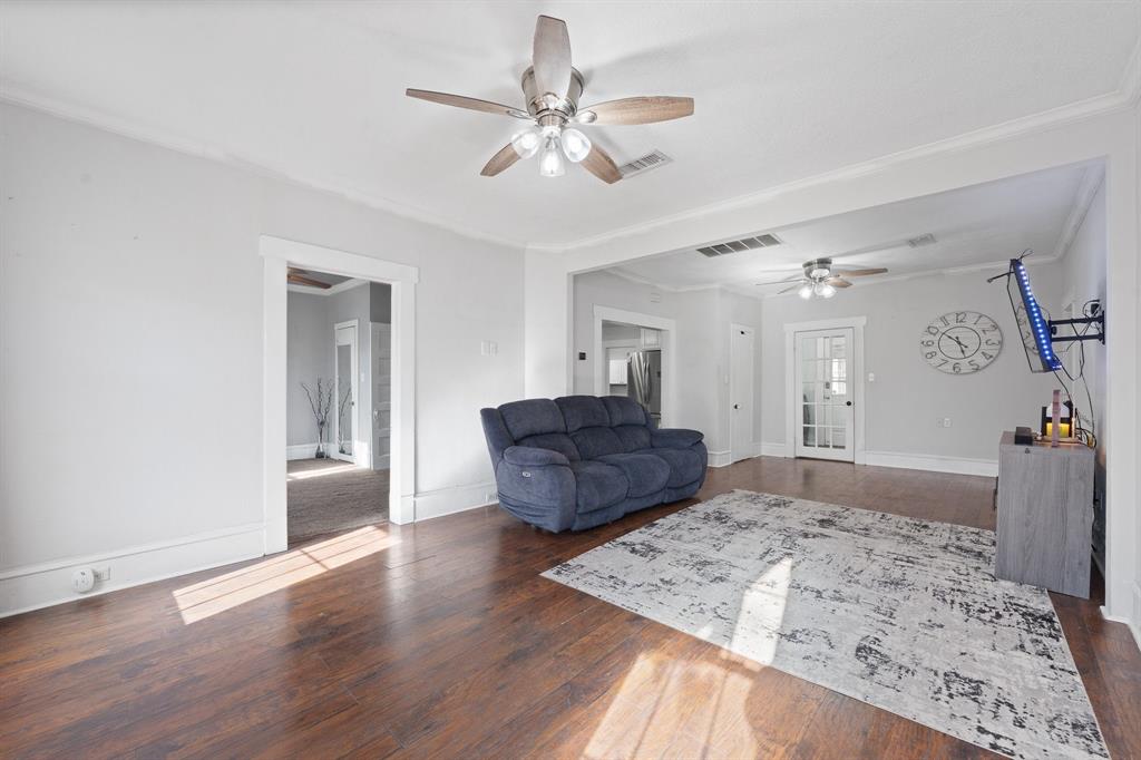 700 Euclid Street Cleburne, TX 76033 - Photo 5 of 35 a living room with furniture and a wooden floor