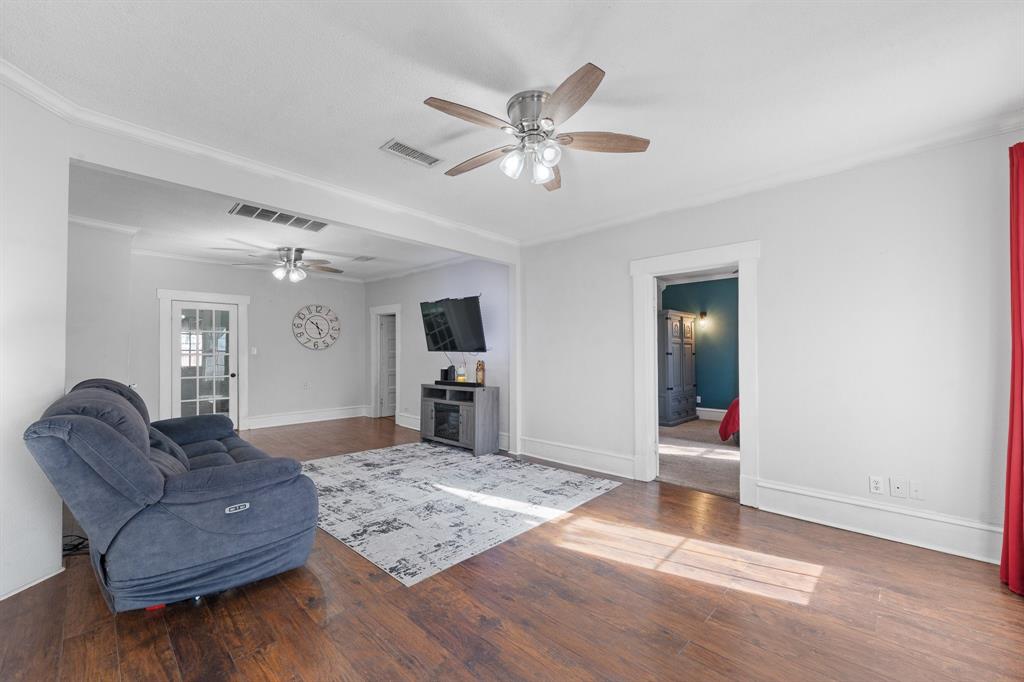 700 Euclid Street Cleburne, TX 76033 - Photo 6 of 35 a living room with furniture and a wooden floor