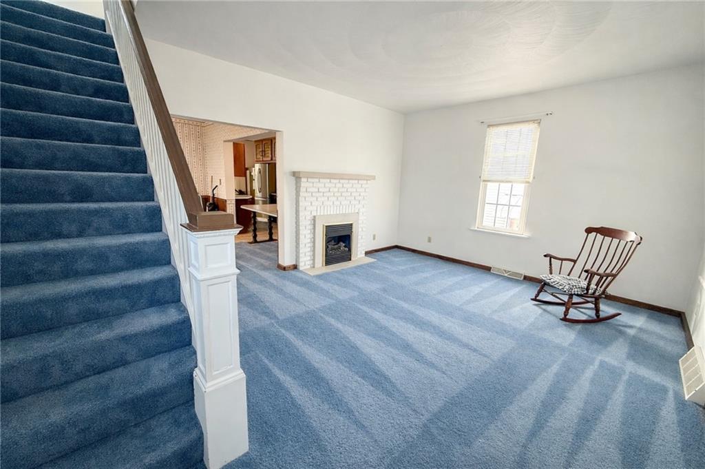 117 Lyon Avenue Butler, PA 16001 - Photo 11 of 43 a view of entryway and hall with wooden floor