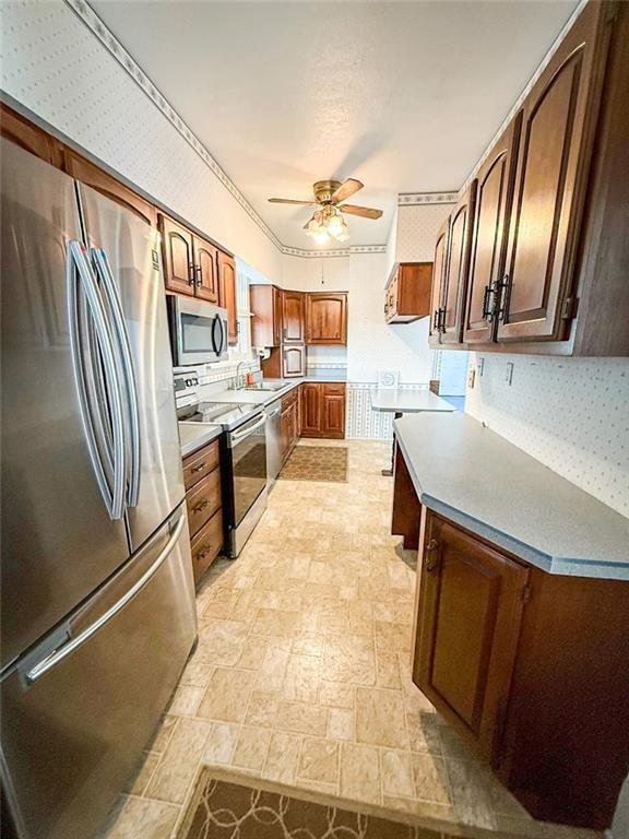 117 Lyon Avenue Butler, PA 16001 - Photo 15 of 43 a kitchen with stainless steel appliances granite countertop a sink stove and refrigerator