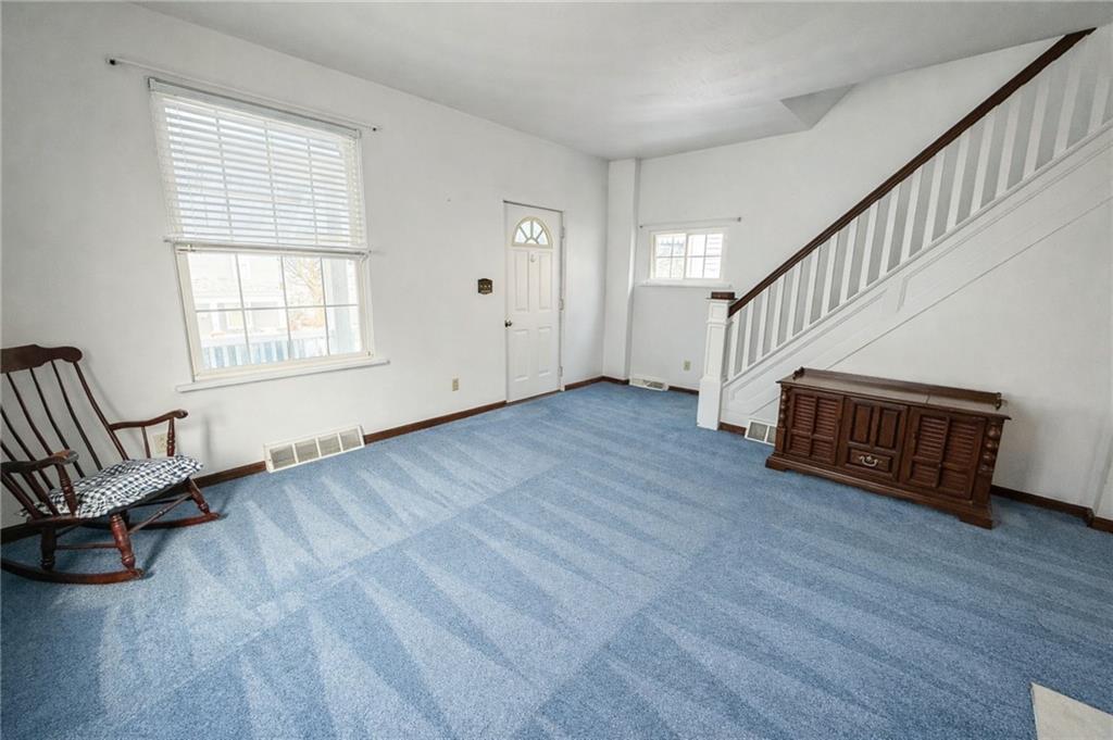 117 Lyon Avenue Butler, PA 16001 - Photo 9 of 43 a view of a room with wooden floor stairs and windows