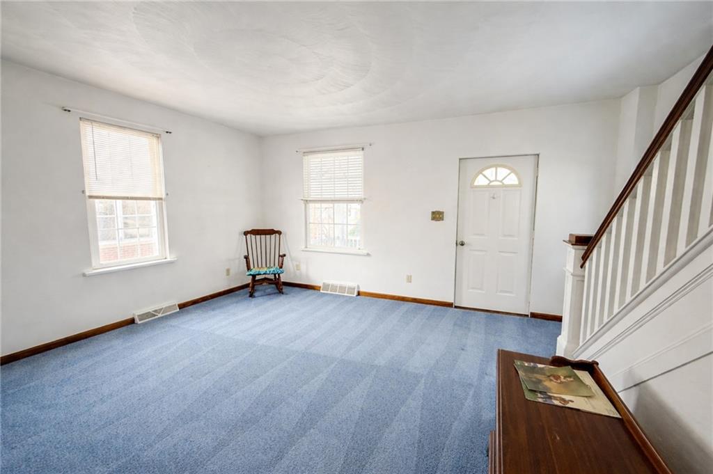117 Lyon Avenue Butler, PA 16001 - Photo 10 of 43 an empty room with wooden floor and windows