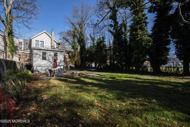 a view of swimming pool and trees in the background