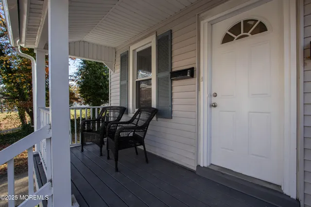 a view of a house with patio and wooden floor