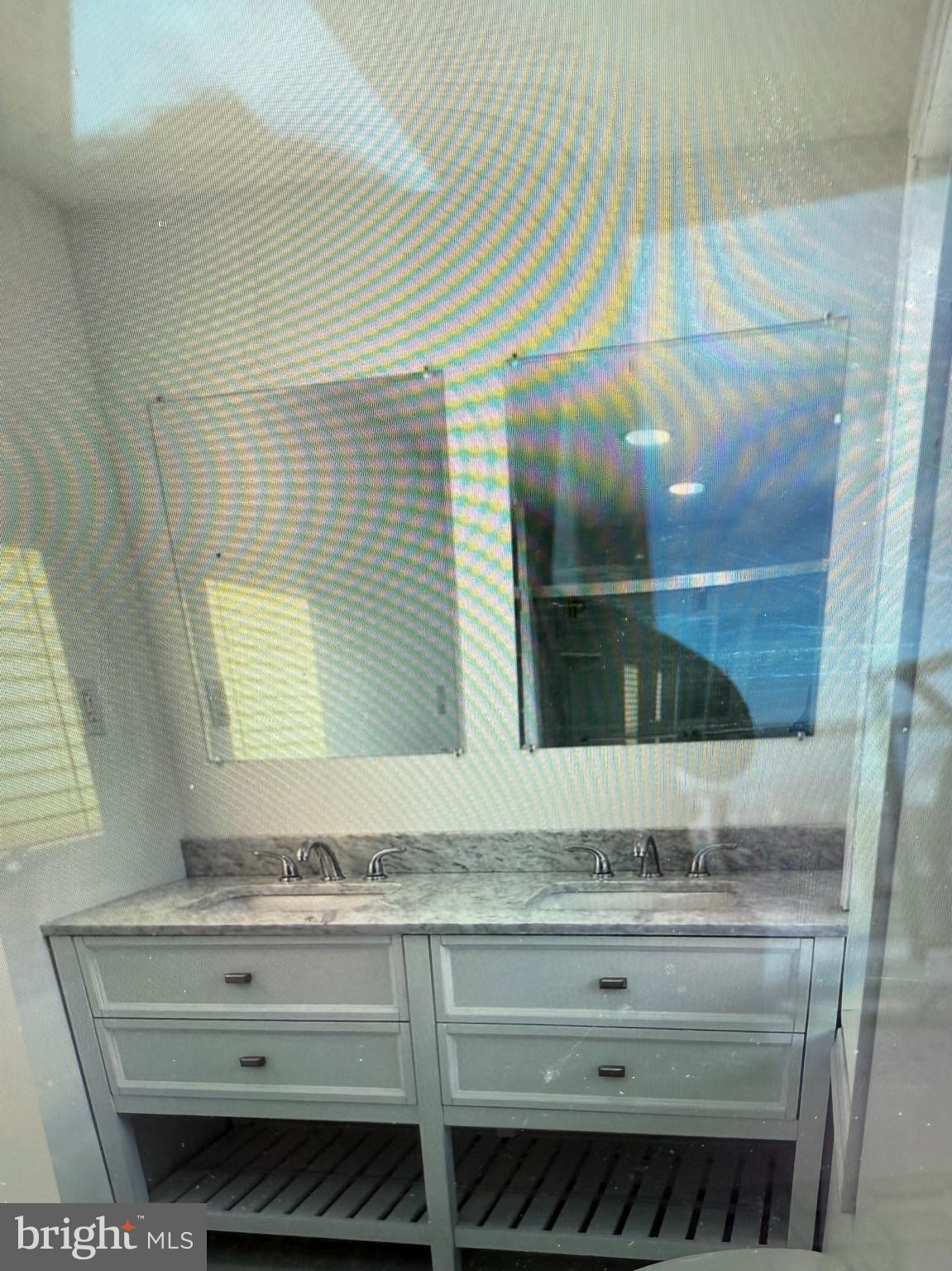 1324 Palethorp Street Philadelphia, PA 19122 - Photo 8 of 9 a bathroom with a sink and mirror