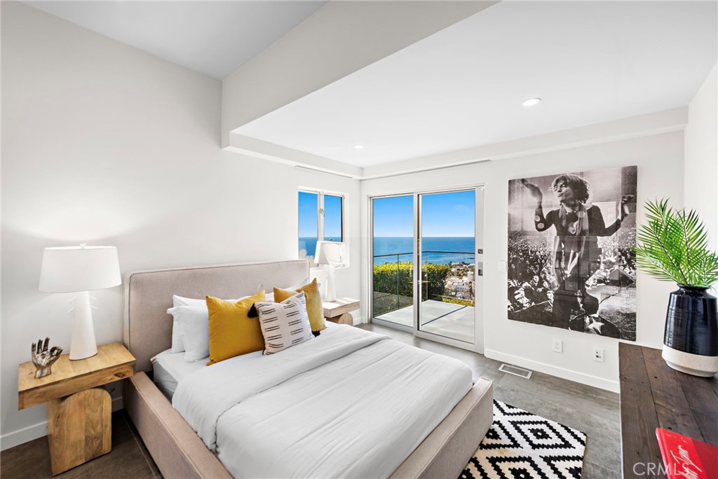 727 Bayview Place Laguna Beach, CA 92651 - Photo 19 of 75 a bedroom with a bed and a potted plant