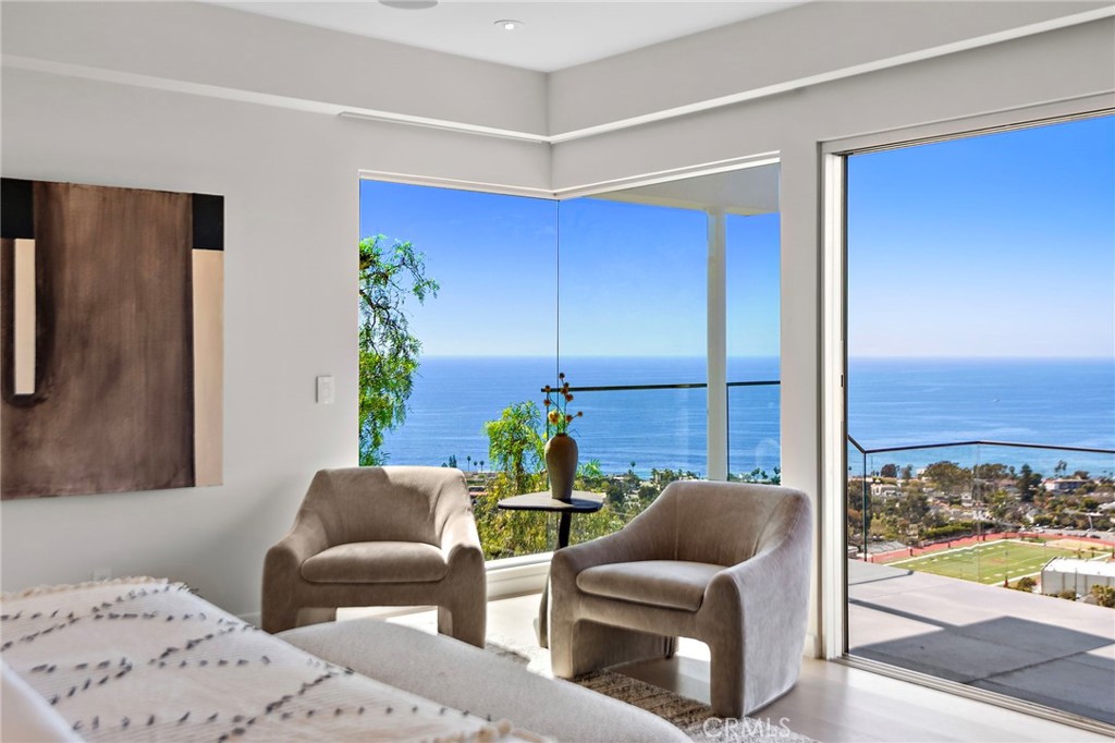 727 Bayview Place Laguna Beach, CA 92651 - Photo 32 of 75 a living room with furniture and a large window