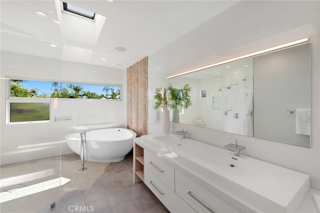 727 Bayview Place Laguna Beach, CA 92651 - Photo 36 of 75 a bathroom with a double vanity sink mirror and toilet