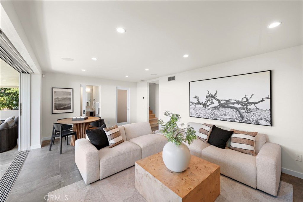727 Bayview Place Laguna Beach, CA 92651 - Photo 55 of 75 a living room with furniture and a painting on the wall