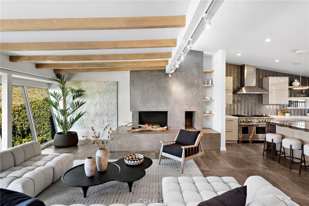 727 Bayview Place Laguna Beach, CA 92651 - Photo 9 of 75 a living room with furniture and a fireplace