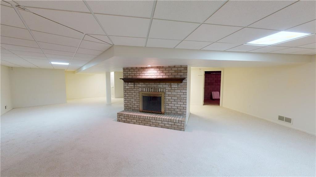 160 Robinson Run Road Butler, PA 16002 - Photo 15 of 25 Family Room in Finished Lower Level Features Brick Fireplace