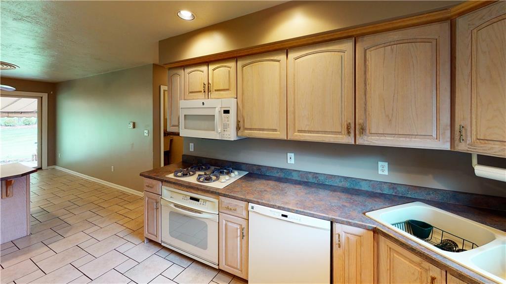 160 Robinson Run Road Butler, PA 16002 - Photo 4 of 25 Kitchen opens to Combination Dining Room with beautiful views of back yard and patio