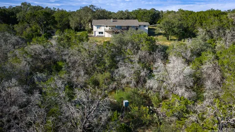 an aerial view of houses with yard